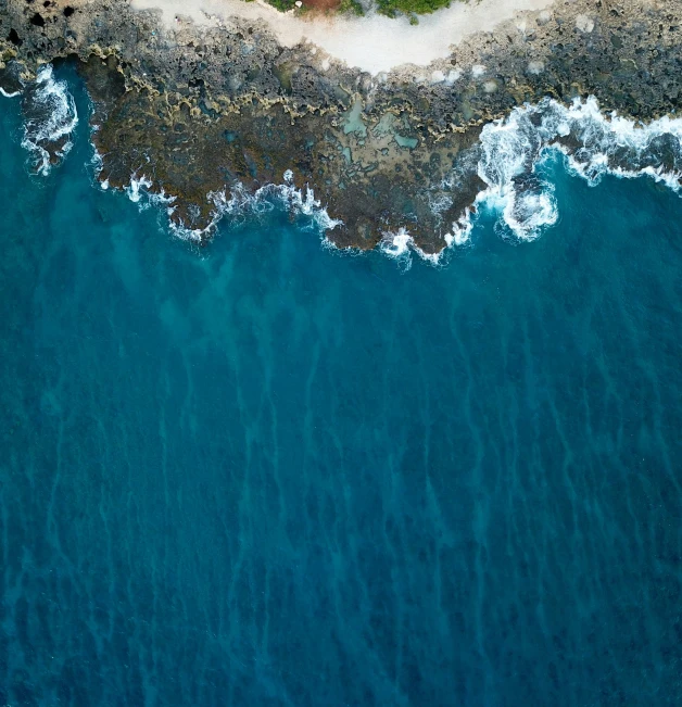 a aerial po of a beach with waves