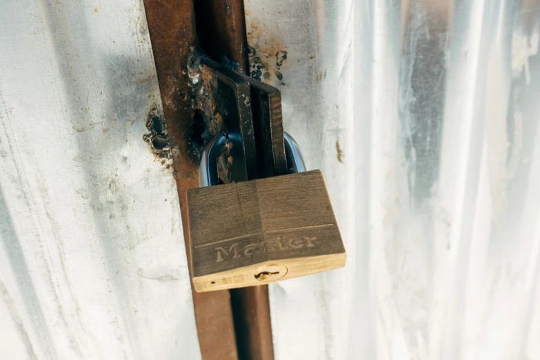 a lock on a gate with rust, stains and stain