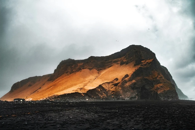 the rock is dark and has bright orange light on it