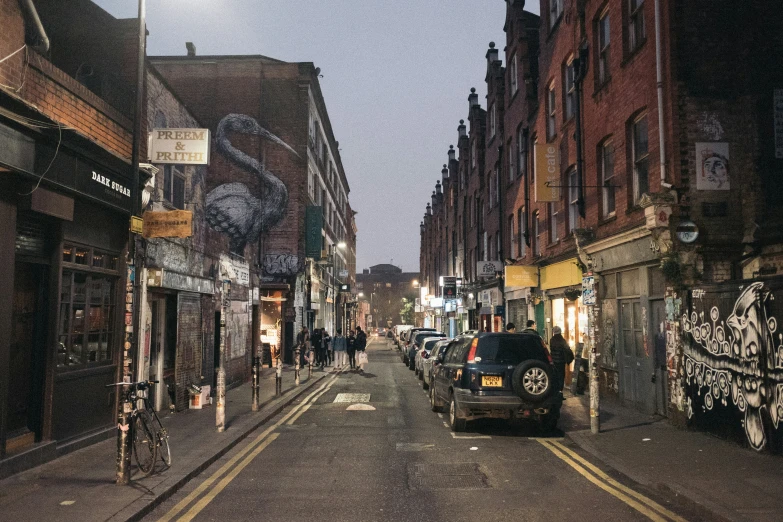 some cars are driving down an old - fashioned street