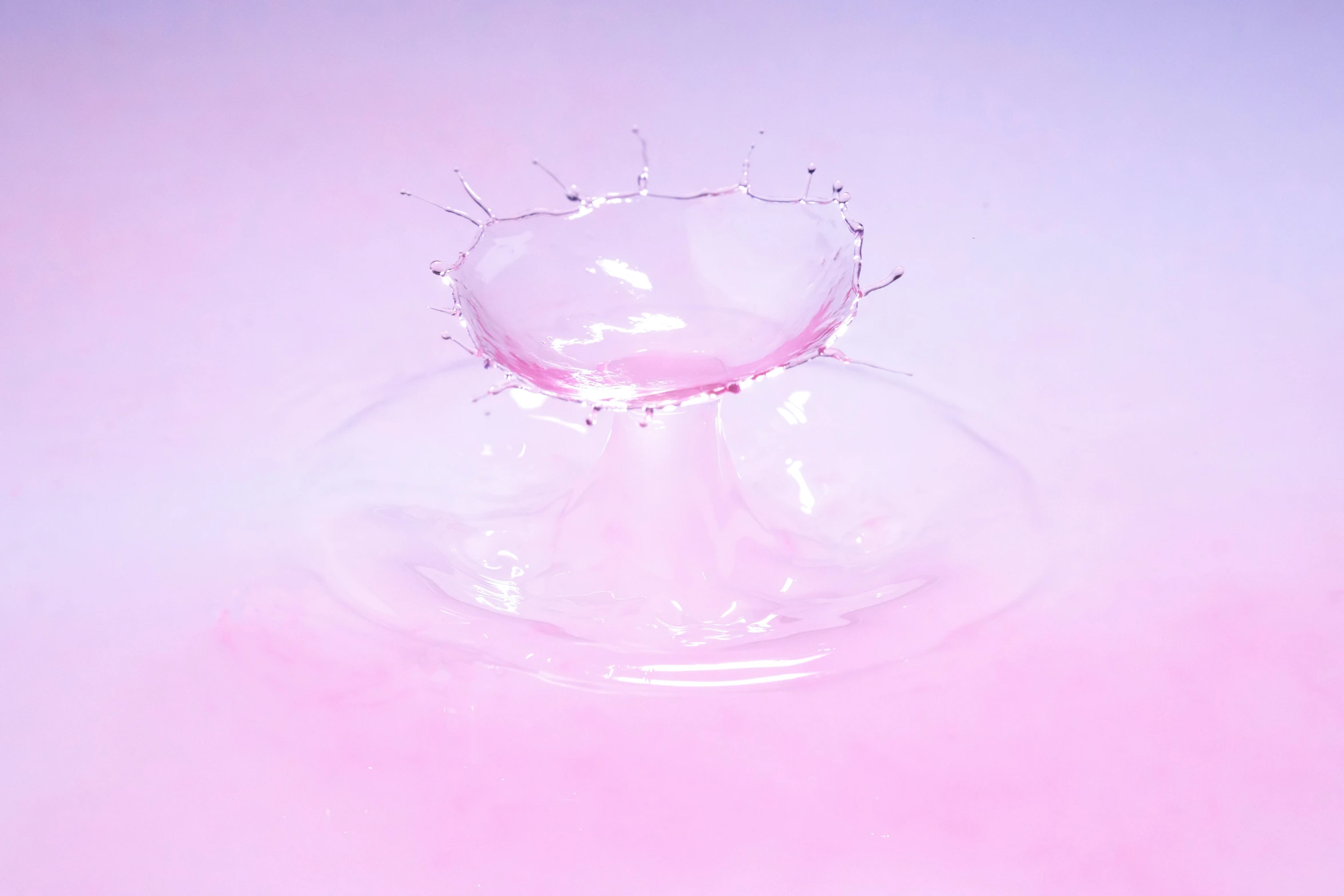 an empty bowl is full of liquid on a table