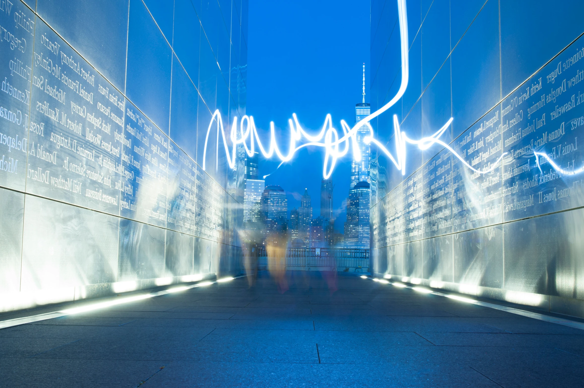 a lit up wall covered in words and buildings