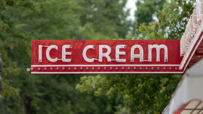 a red sign with the words ice cream on it