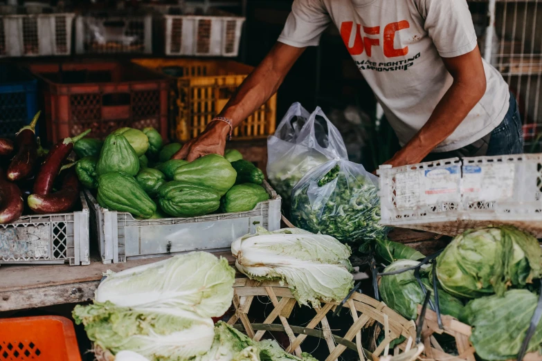 the vegetables for sale are in crates