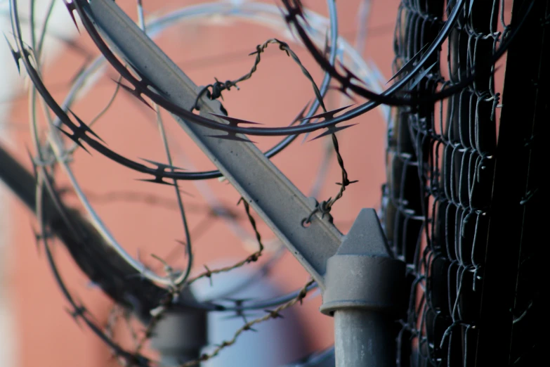 the chain linked fence is on top of a building