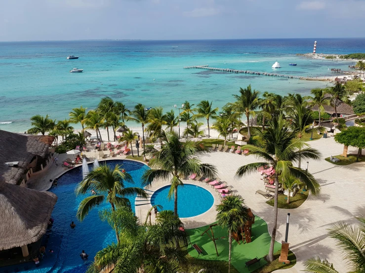 an overhead view of a resort with many palm trees