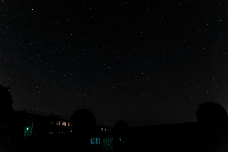 an image of night sky over some building