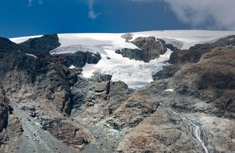 the view from a helicopter shows mountains and snow