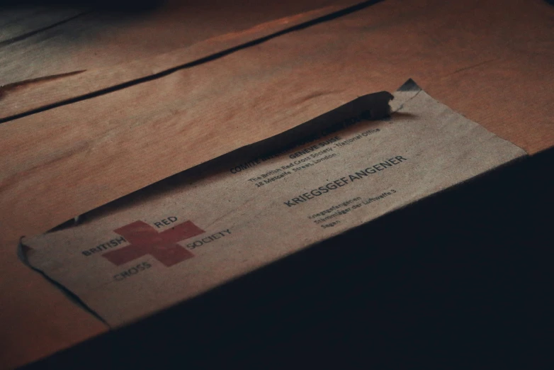 a piece of cardboard sitting on top of a wooden table