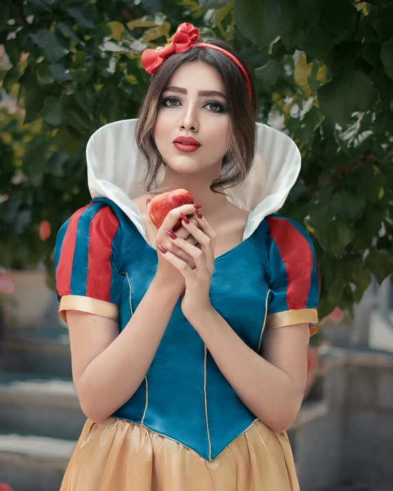 a young lady dressed as snow with apple