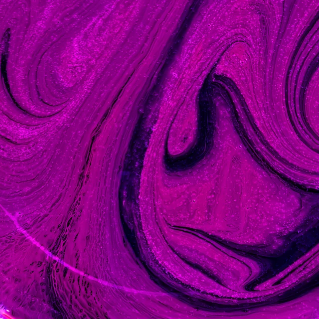 a dark purple swirled texture of paint