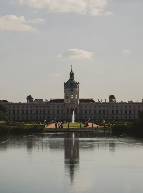 a large palace with some water and buildings