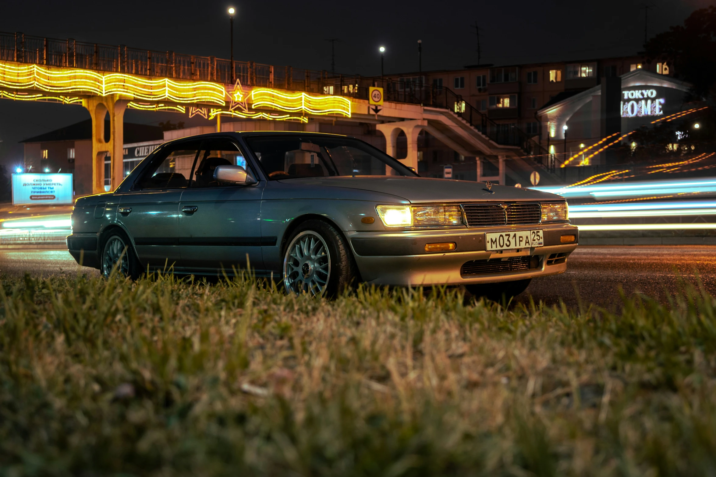 a car driving down the road at night