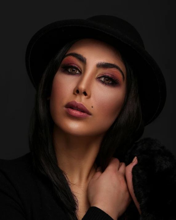 a woman in a black hat with red makeup