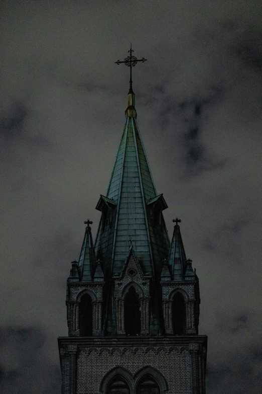 a large clock tower with a sky background