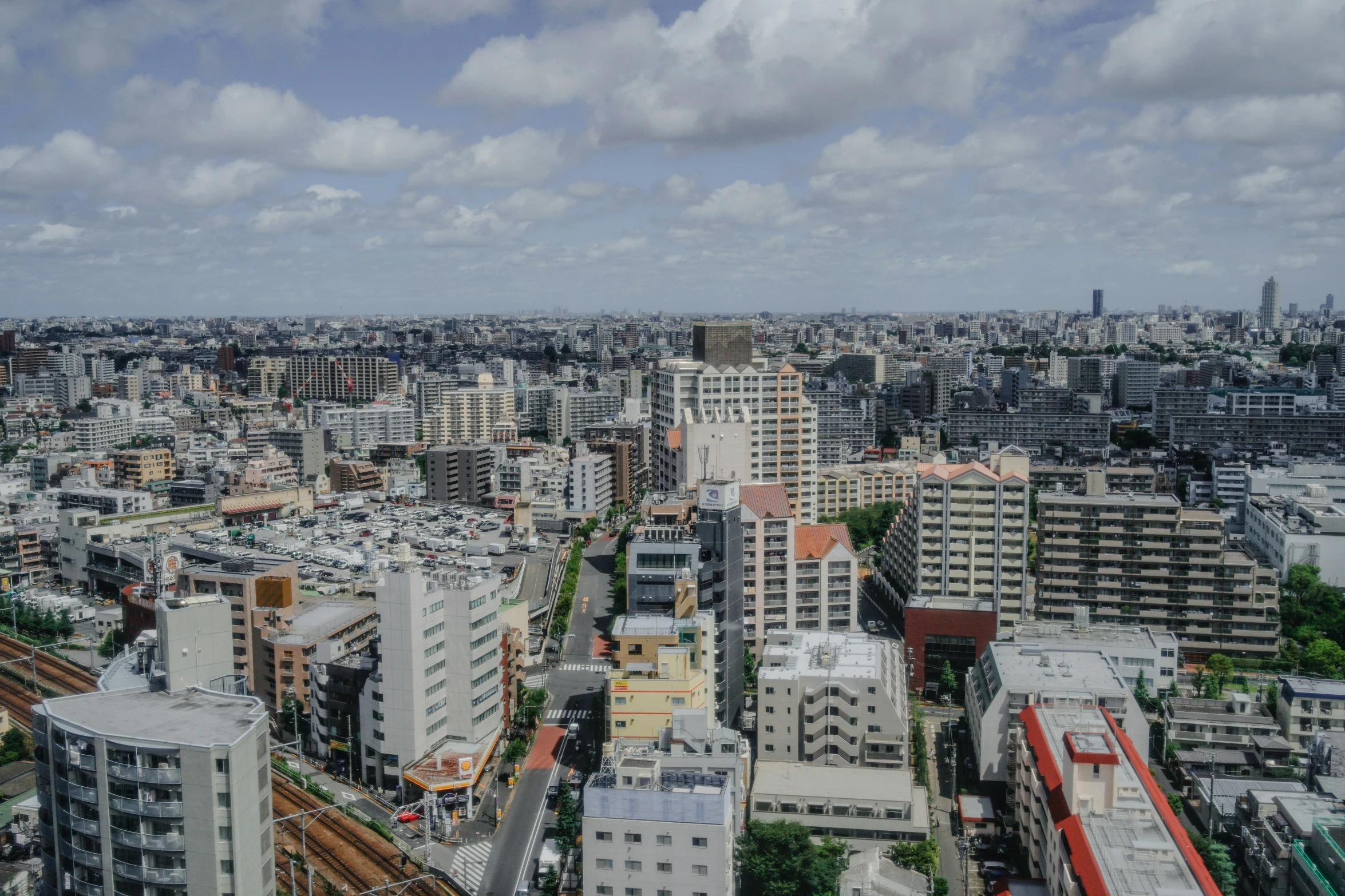 a view of an area where lots of tall buildings and traffic