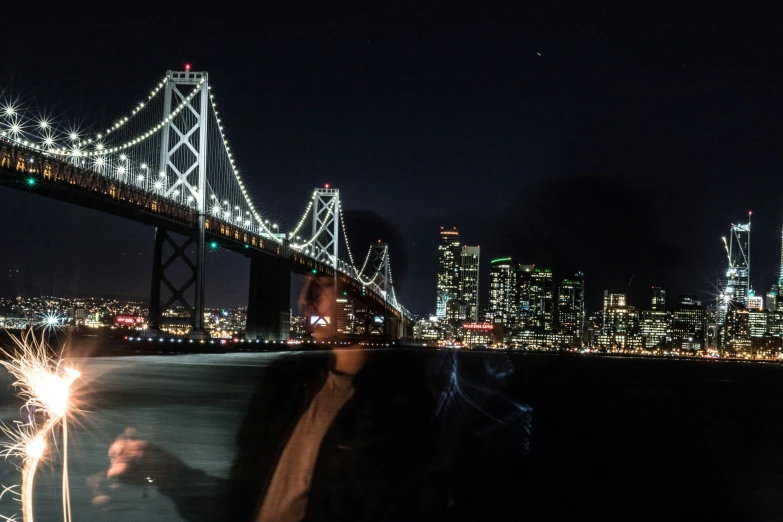 the view from a boat at night time of city lights