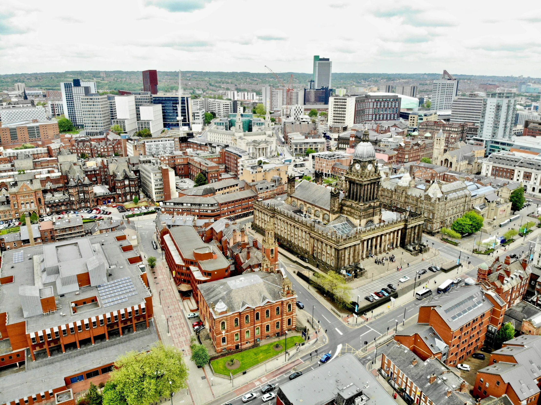 an overhead view of a large city with a clock tower