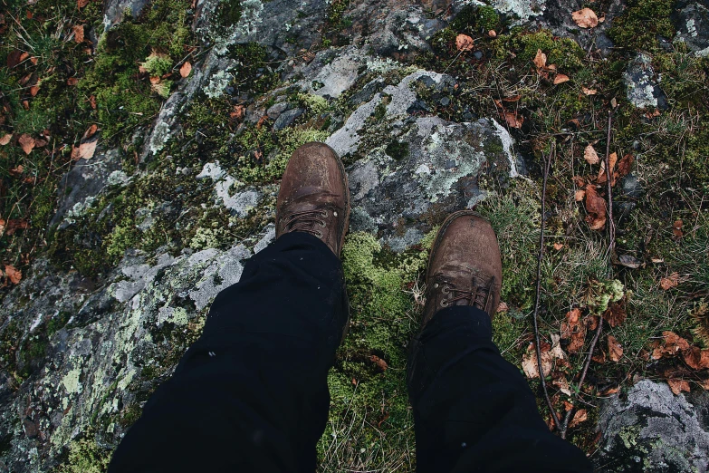 the image is taken looking down at someones feet