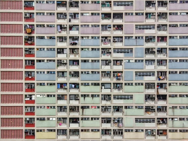 a tall building with many windows and balconies