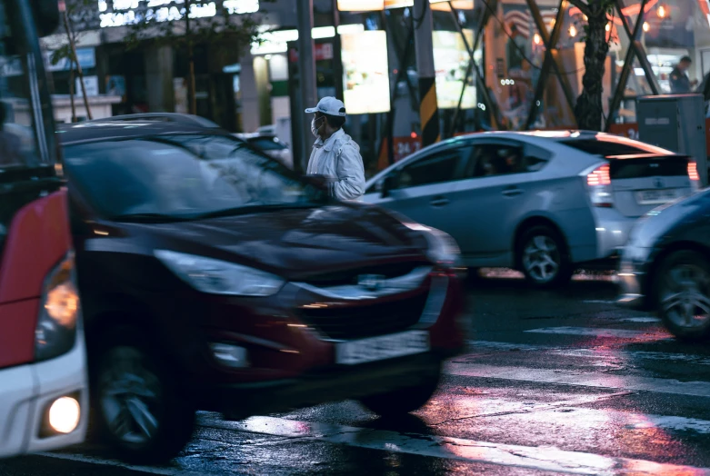 cars and trucks parked near one another and traffic lights