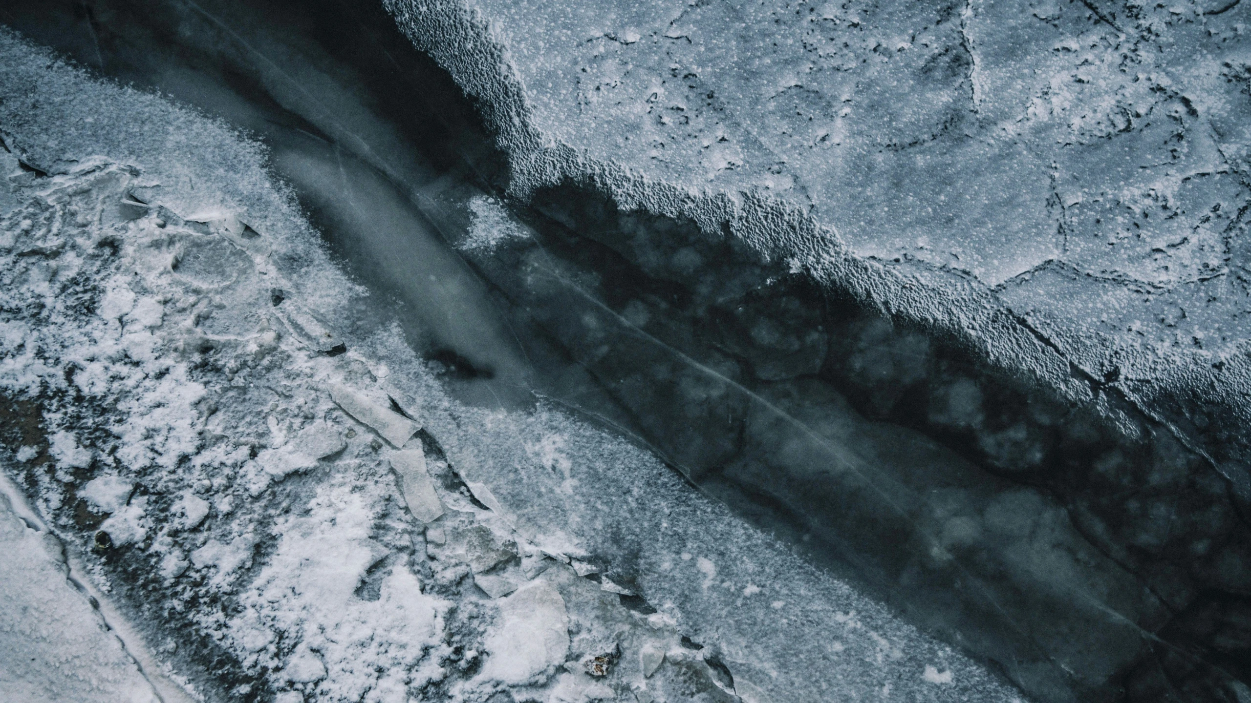 top down s of a concrete surface that has snow on it