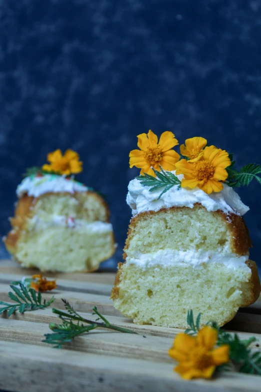 a white cake with frosting and yellow flowers