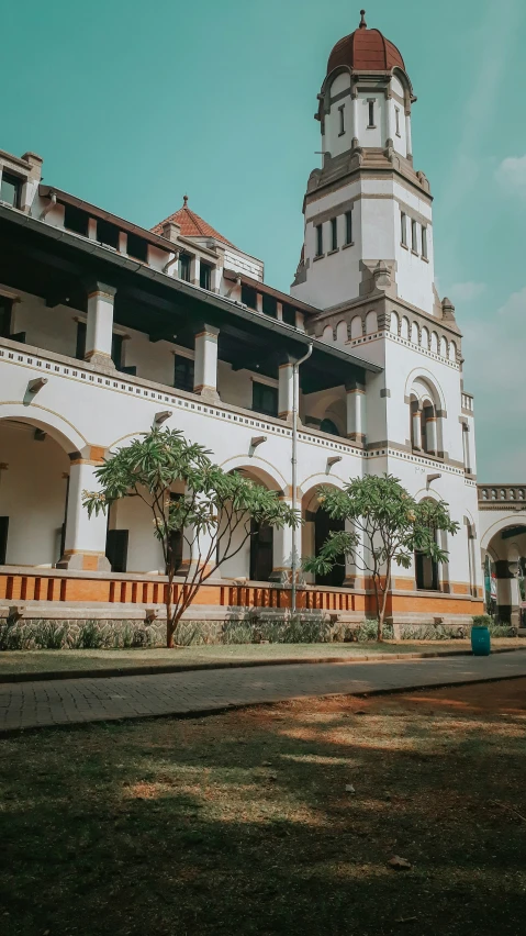 a building with a clock on the side and many windows