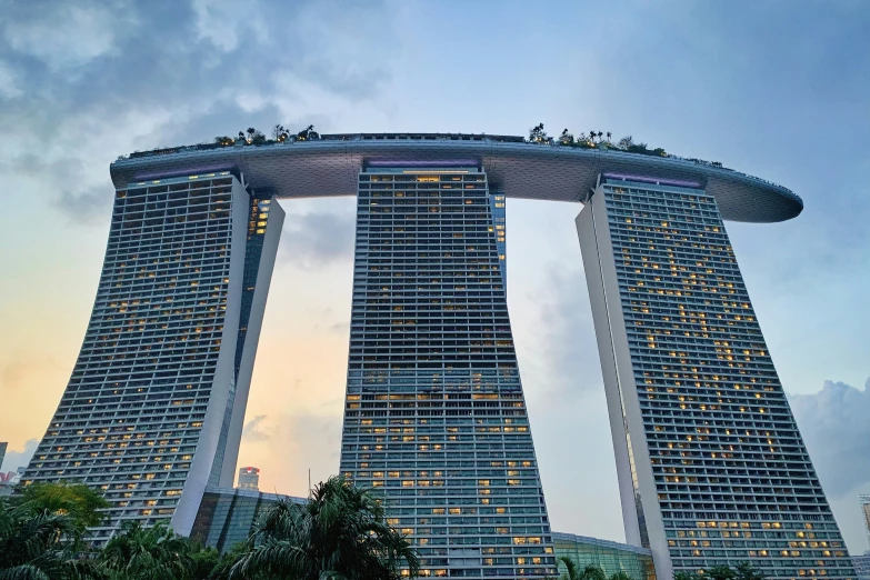 the towers are tall and lit up at dusk