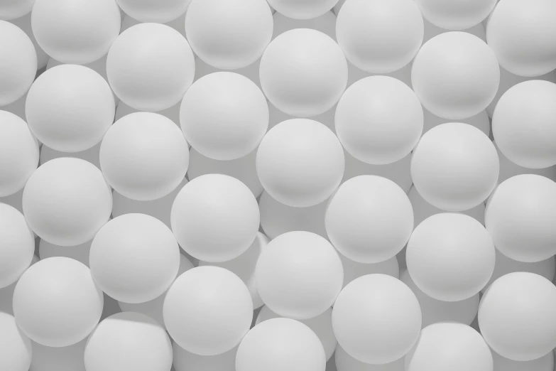 a group of white eggs stacked on top of each other