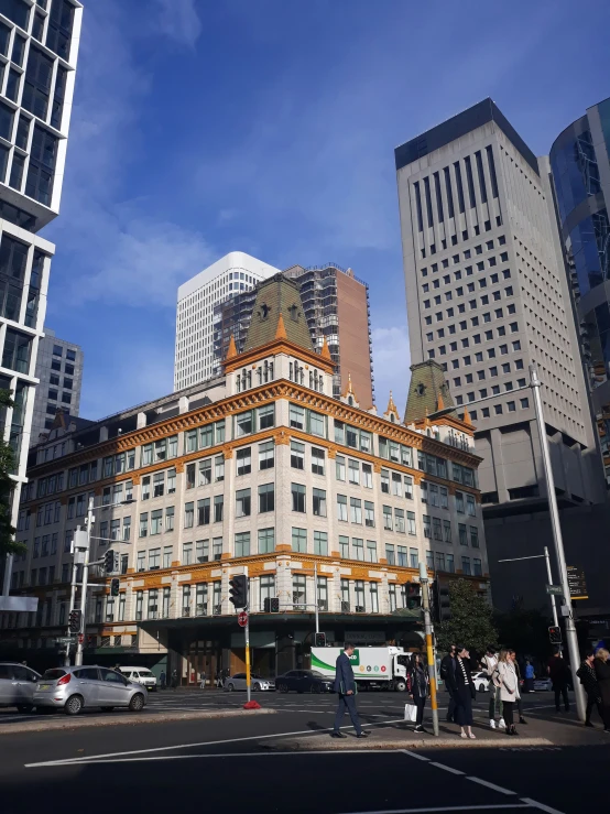 an urban intersection with several tall buildings in the background