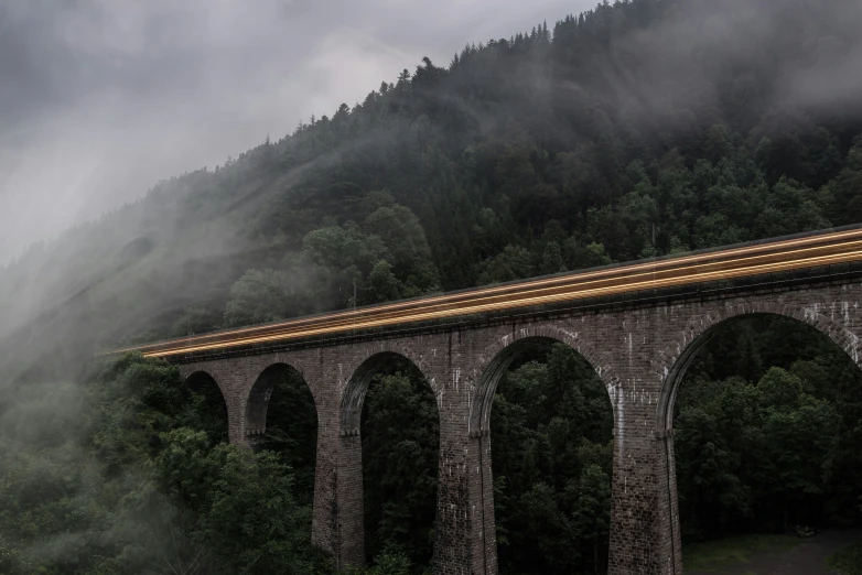 a train on an old track over a bridge