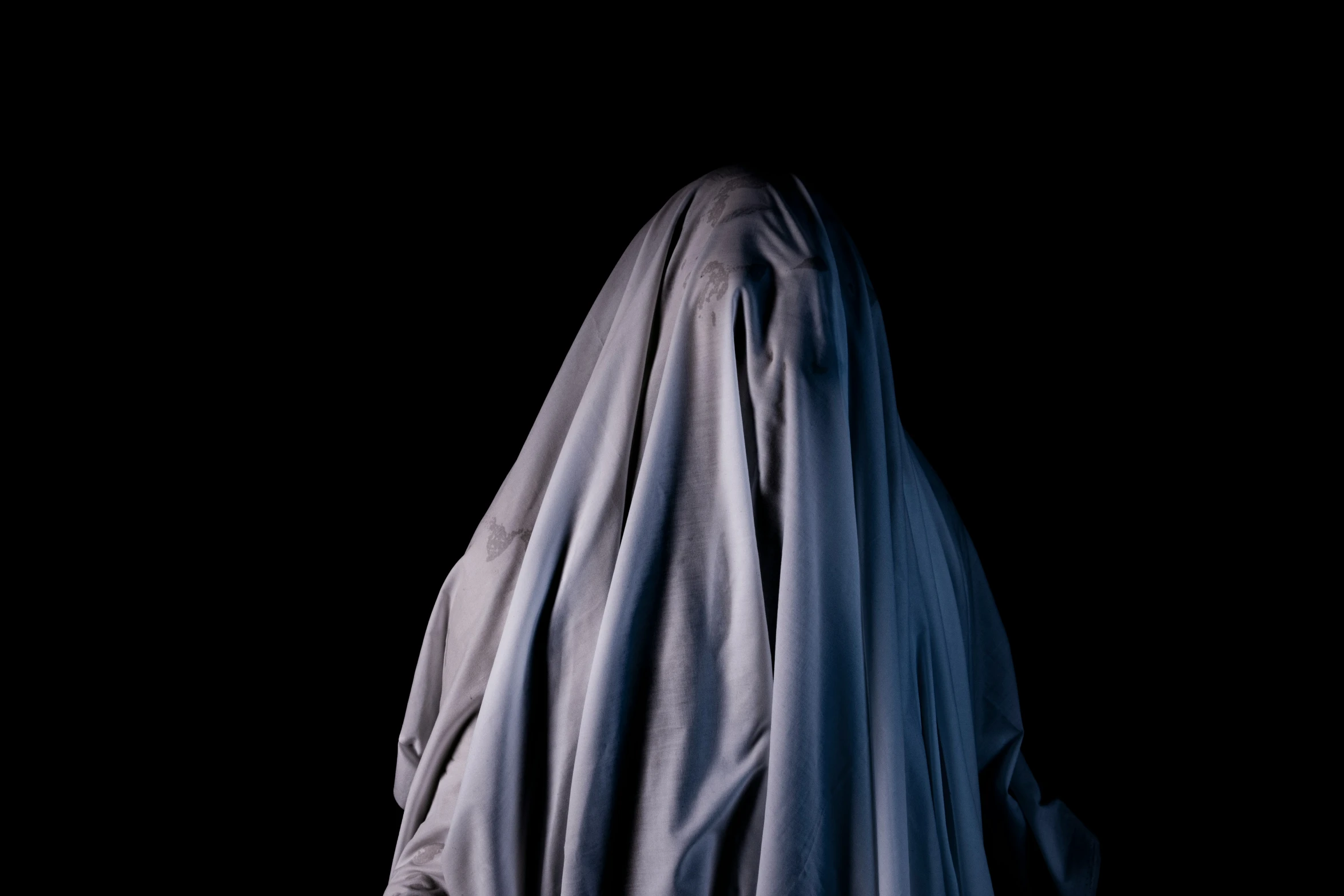 an image of a creepy person with a scary veil on