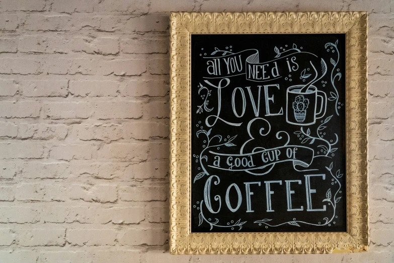 a black and white po of coffee sign on a wall