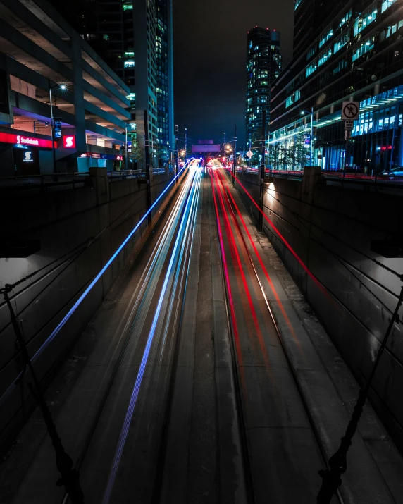 an image of car lights in the night on a busy street