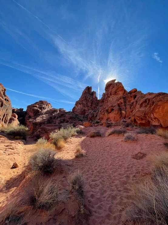 a group of rocks with vegetation in the middle of them