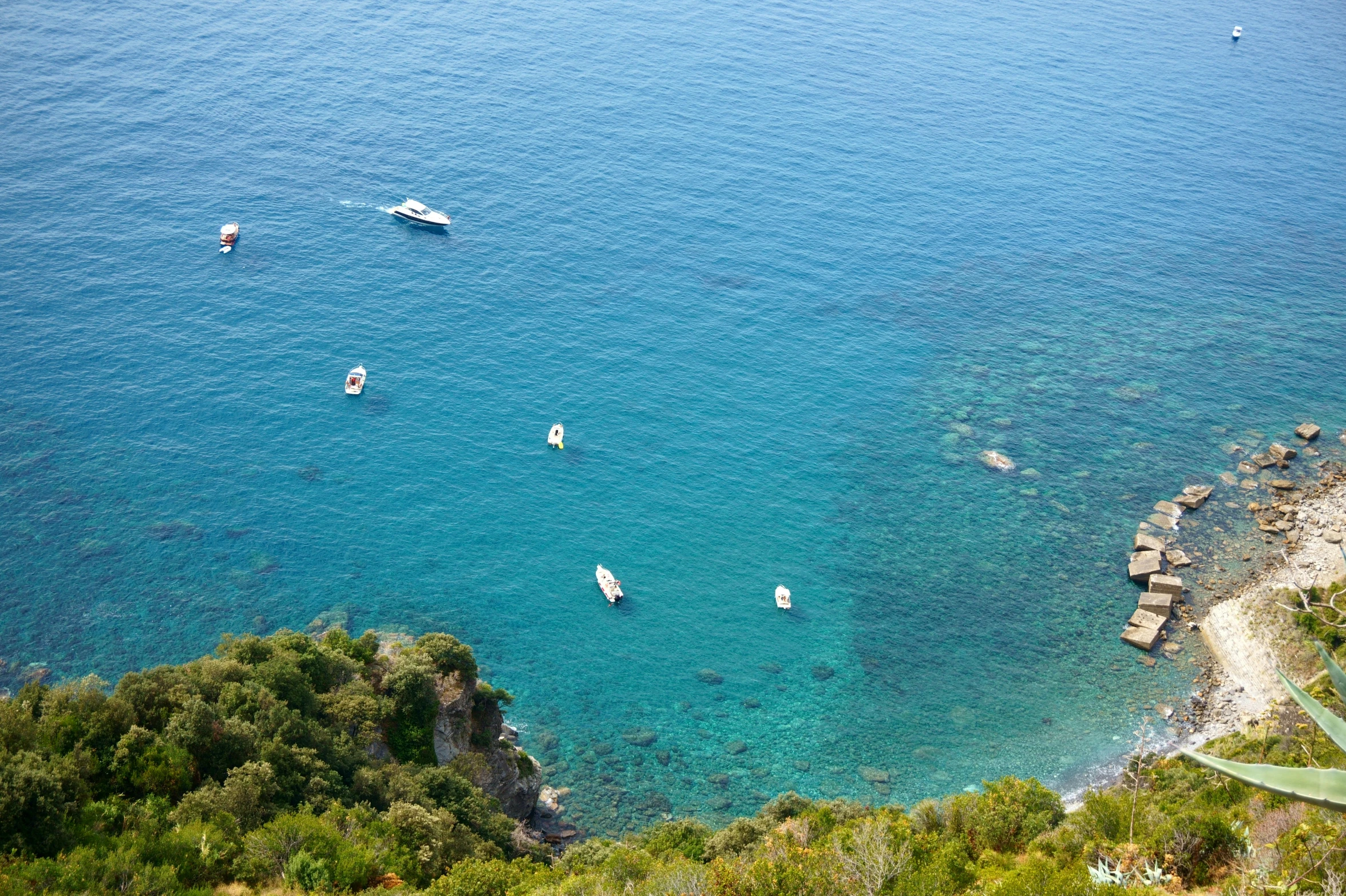 the clear water in this tropical island is perfect for boating