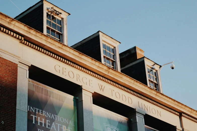 the building is decorated with banners on the outside