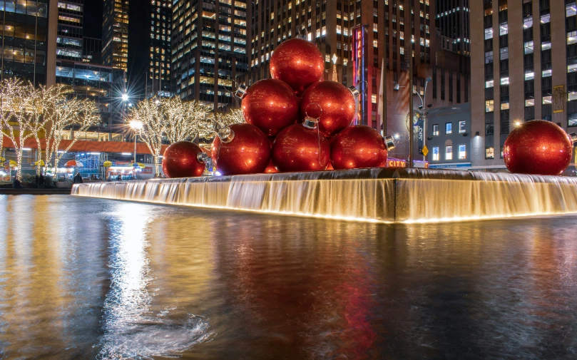 christmas balls on a waterfall in the middle of the water