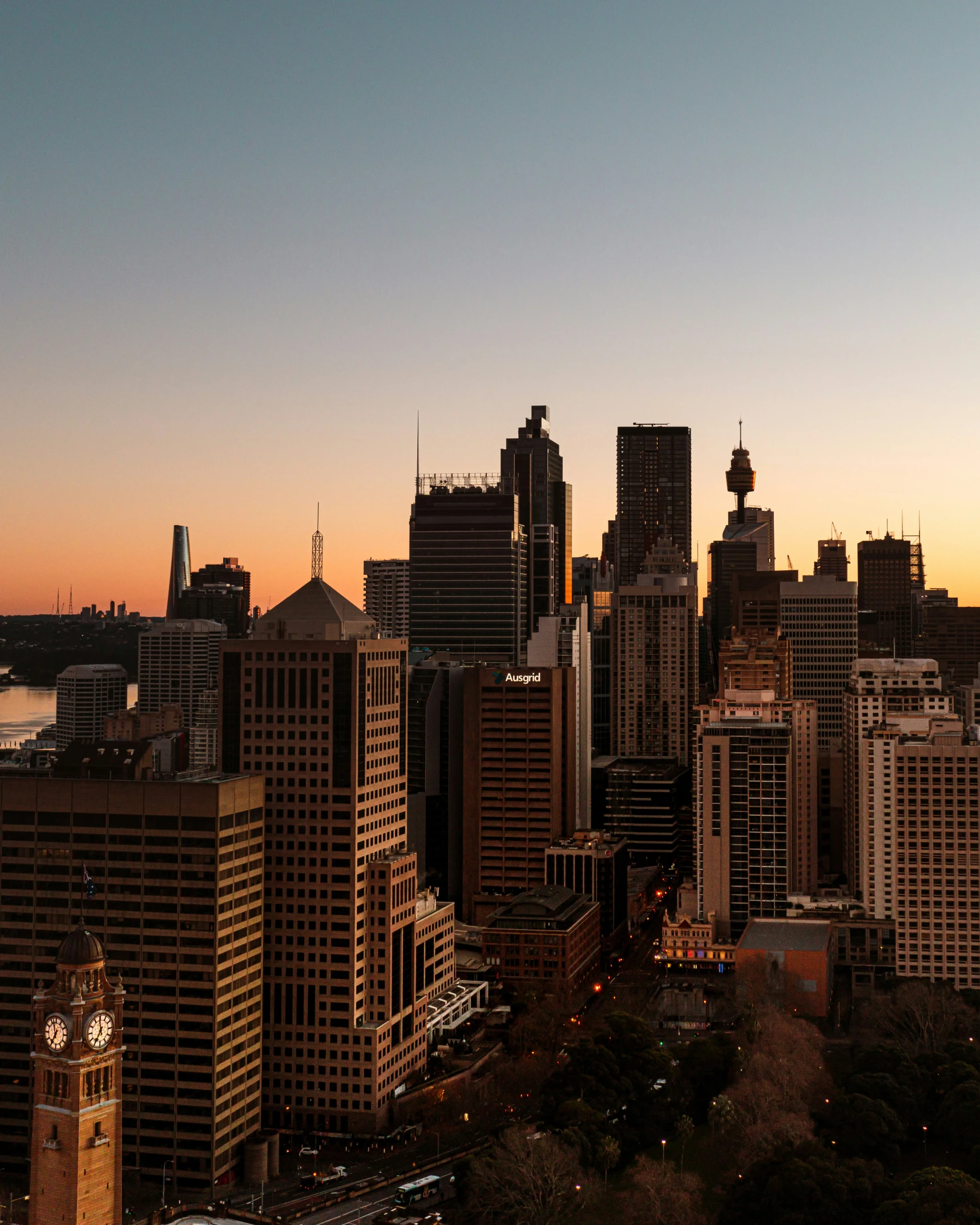 an aerial view of the city of sydney at dusk