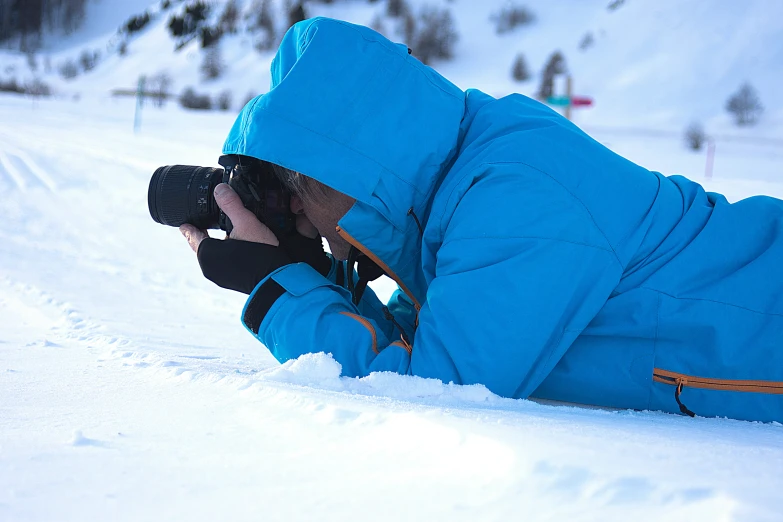 a snow skier takes a break from skiing in the snow