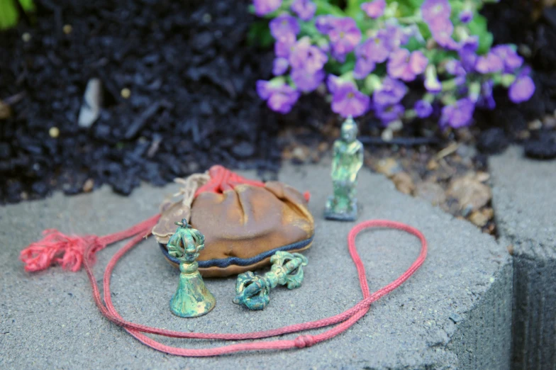 a bag with a cord tied to it on the ground