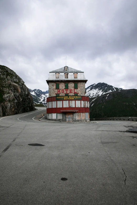 an old building on the side of a mountain