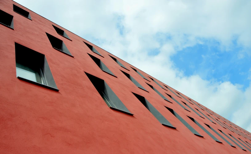 there are three windows in the wall of this building