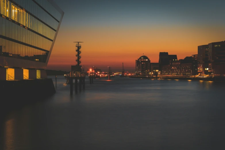 an urban skyline with buildings at dusk