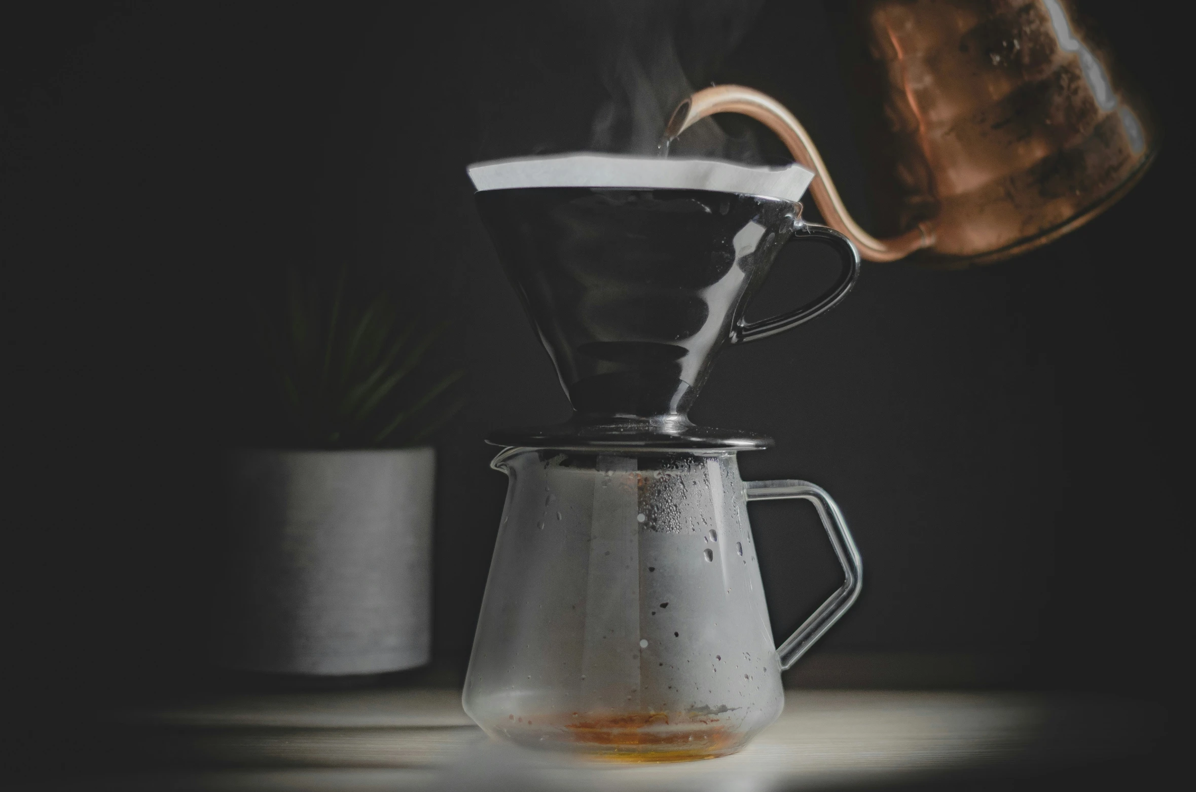 a pour is being poured into a coffee pot