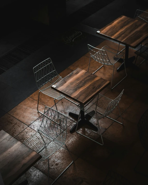 two desks and chairs are sitting next to each other