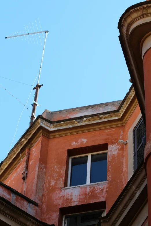 a sky view from outside of a window with a tower on top