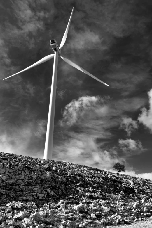 an image of a wind turbine on a hill