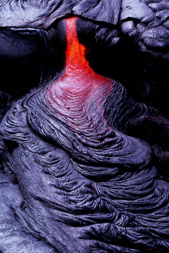 lava inside a mountain with a small black hole in it